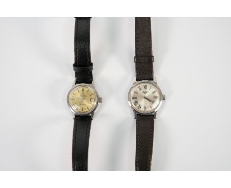 Lady's stainless steel Omega wrist watch. The case measures 22mm diameter, having a gold effect face with date aperture on a 