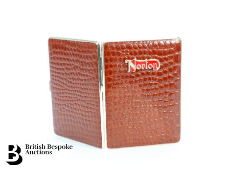 Crocodile leather cigarette case bearing a Norton Motorcycles red enamel emblem, appears unused, approx 8 x 10.5 cms.&nbsp;
