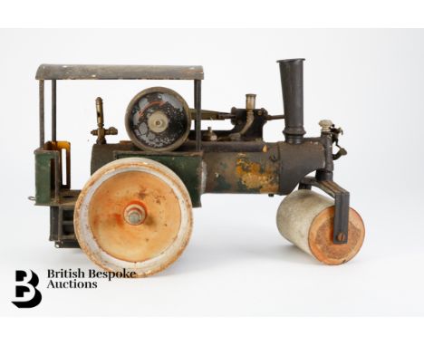 A Marklin vintage toy German steam roller, nor 4804, approx 28 x 17 cms h, with remnants of green livery and red wheels.