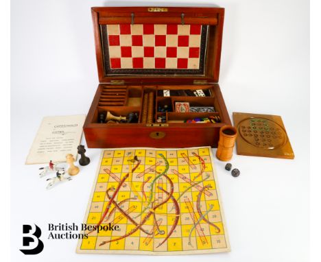 A boxed compendium of games containing a board that folds to play Chess, Draughts, Backgammon, Race &amp; Steeplechase, Snake
