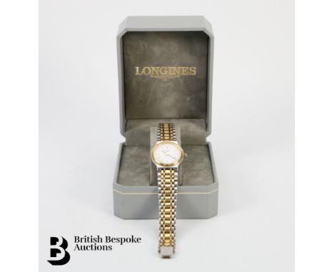 A lady's stainless steel and gold plated Longines wrist watch, Quartz movement, case measures 22mm, complete with booklet and