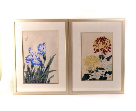 A pair of Japanese wood cut flower prints, one of blue and white flowers, the other red and yellow, framed and glazed, approx
