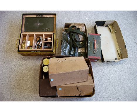 A selection of military First Aid equipment, comprising gauzes, bandages, medicine and more, together with a selection of tin