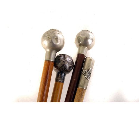 A silver Borders Regiment swagger stick, together with three plated swagger sticks, for the Norfolk, 13th County of London an