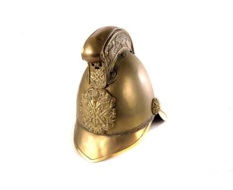 An early 20th century brass Merryweather pattern fireman's helmet,  with dragon comb and pierced vent cover above a shaped an