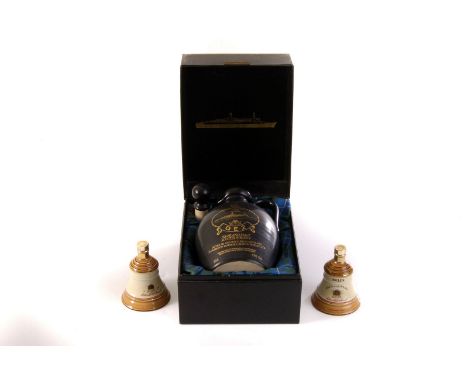 A QE2 commemorative Highland Malt Scotch Whisky decanter, in fitted box, together with two small Wade bell shaped Bells whisk