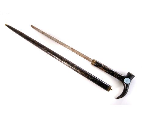 An ebonised sword stick, having carved decoration, with button release top revealing 46.5cm long blade