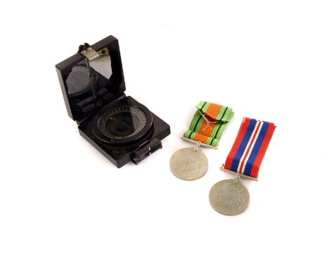 A pair of WWII War and Defence medals, together with a military Marching Mk1 compass by T.G.Co Ltd (3)