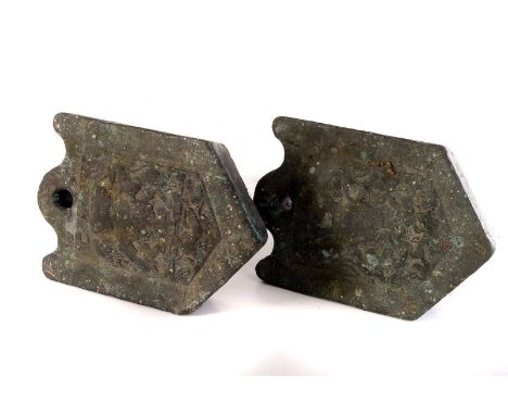 Two vintage wool weights, both having crest design to front