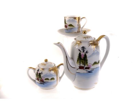 A Kutani ceramic four piece tea set, having oriental style lake scene decoration, comprising tea pot, cups and saucers, milk 