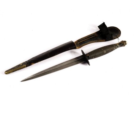 A Sykes-Fairburn 3rd pattern fighting knife, presented in original scabbard though modifications have been made