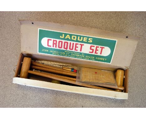 A Jacques of London Croquet set, comprising mallets, balls, hoops, a peg and instruction manual, in original box