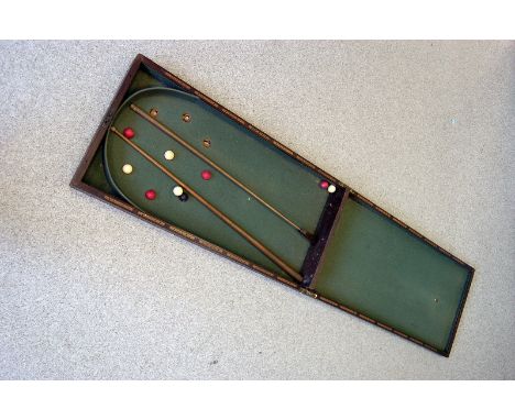 A vintage table top bagatelle game, including balls, cue and clearer (parcel)