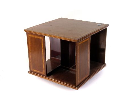 A mahogany inlaid book trough, together with a matching table top revolving bookcase (2)