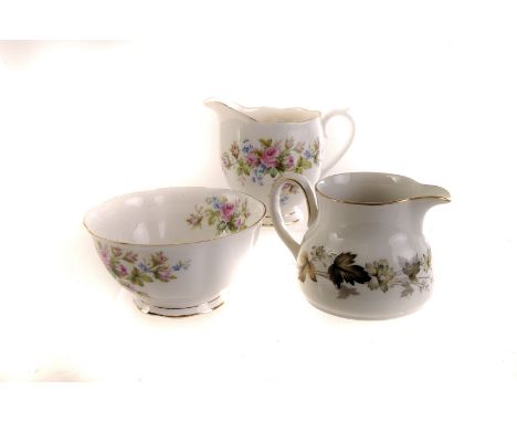 A Royal Doulton Larchmont pattern part service, comprising cups and saucers, graduated plates, milk and cream jug, water jug,