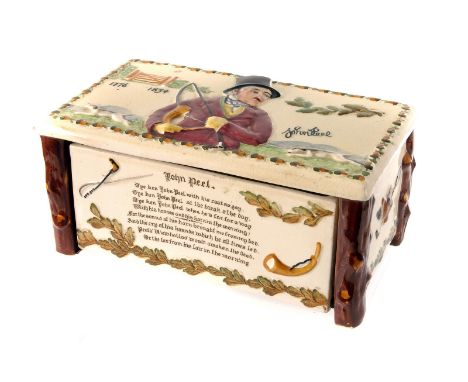 A John Peel ceramic musical cigarette box, having raised decoration of John Peel and hunting dogs to top, with a poem to fron