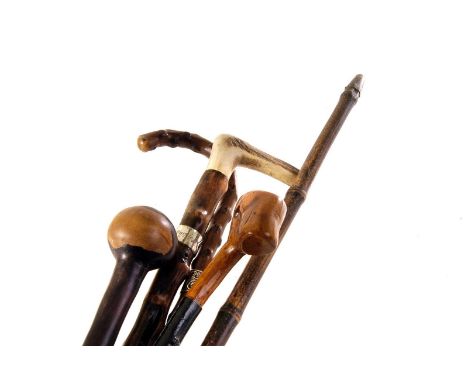 Four vintage walking sticks, including an antler handled example, plus a knop Kerri (5)