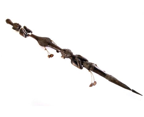 A chiefs carved wood stick/spear, possibly Zulu, having two carved figures of males with their hands together, with additiona