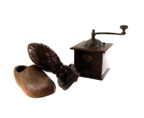 A collection of wooden items, to include a washing dolly, a coffee grinder, a finial, a carved tray and a pair of wooden clog