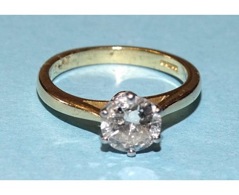 A solitaire diamond ring claw-set a brilliant-cut diamond of approximately 0.9cts, PI, in 18ct yellow gold and platinum mount