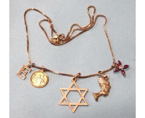 A 9ct gold box-link neck chain, 40cm, with ruby and diamond pendant and four other 9ct gold pendants, 6.1g.