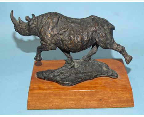 Keith Calder (South African, b.1959), a bronze sculpture of a rhinoceros, signed and dated 89, numbered 139/450, on wooden ba