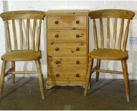 A small pine chest of five drawers, on bracket feet, 50 x 90cm and a pair of modern beech lathe-back kitchen chairs, (3).