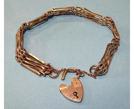 A 9ct rose gold gate-link bracelet with padlock clasp, 19cm, 9mm wide, 10.9g.