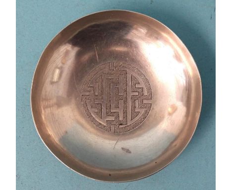 A small Chinese silver dish with engraved character design to centre, 8cm diameter, ___1.8oz.