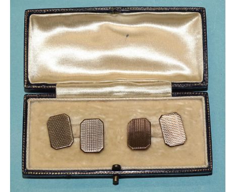 A pair of 9ct gold engine-turned cufflinks, (cased), 4.2g.