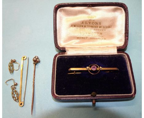 A 9ct gold bar brooch set amethyst and seed pearls, cased, a 9ct gold bar brooch, a pair of unmarked earrings and a pearl set
