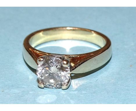 A solitaire diamond ring four-claw-set a brilliant-cut diamond of approximately 1.2ct, SI, M, in 18ct yellow gold mount, size