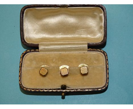 A cased set of three 9ct gold engine-turned dress studs, 4.4g.