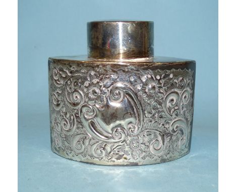 A late-18th/early-19th century tea caddy of shaped oval form, with embossed scroll and foliate decoration, 7.5cm high, 8.5cm 