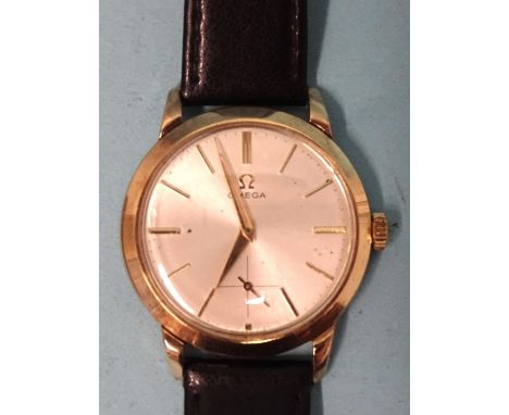 Omega,&nbsp;a gentlemen's 1954 14ct gold cased wristwatch, the silvered dial with baton numerals and seconds subsidiary, the 