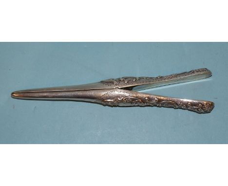 A late-Victorian pair of glove stretchers with embossed scroll decoration, 20cm, London 1894, maker Mappin & Webb, ___2.9oz, 