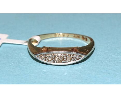 An 18ct gold ring set five small graduated diamonds, size K, 2.6g.