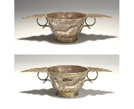An undated silver-gilt kylix in 5th-3rd century BC style, with stepped base, deep bowl, ribbed rim; two lateral loop handles 