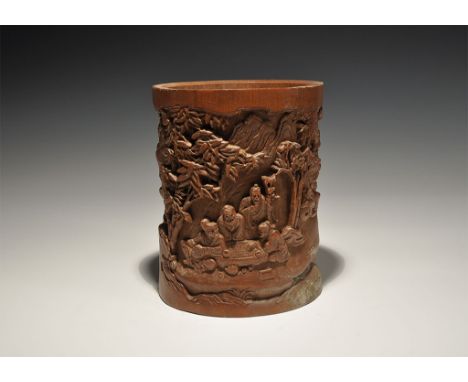 19th-early 20th century AD. A tall pot carved from a section of bamboo stem with figural scenes including two musicians playi