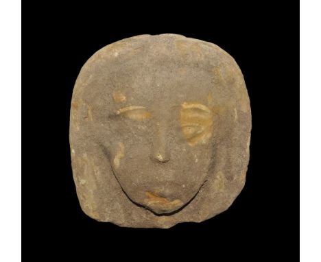 An undated archaistic ochre ceramic head with lentoid eyes and tripartite wig. 1.1 kg, 17.5 cm (6 3/4). Property of a London 