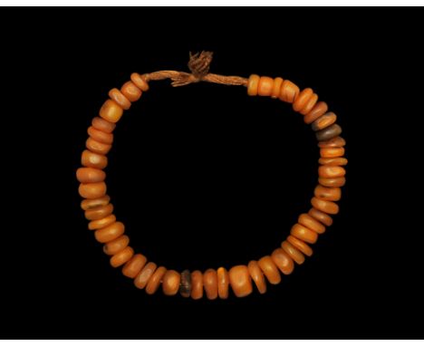 20th century AD. A necklace of vintage ethnic style irregular beads resembling african amber. 224 grams, 62cm long (24 1/2").