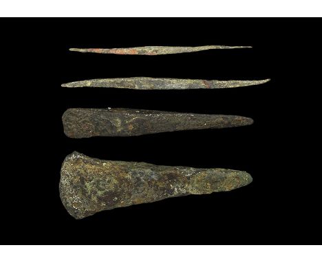 2nd millennium BC. A mixed group comprising: a triangular chisel with curved blade; a square-section chisel tapering to each 