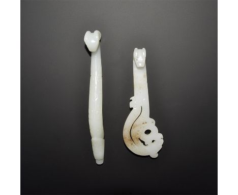 20th century AD. A mixed pair of faux-jade belt fasteners, each with a stud to the reverse and extended neck with hooked beas