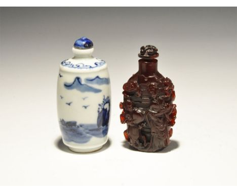20th century AD. A mixed pair of snuff bottles comprising: one white-glazed ceramic with mountains and seascape; one composit