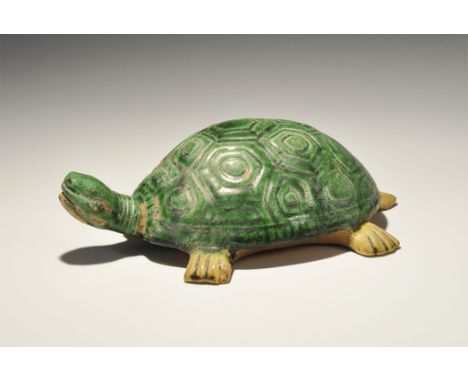An undated archaistic green-glazed ceramic tortoise, hollow to the underside. 396 grams, 20cm (8). Acquired on the London art