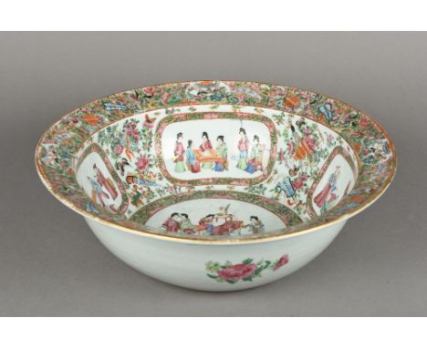 A Chinese Canton porcelain punch bowl Typically decorated with figural vignettes interspersed with floral sprays and precious