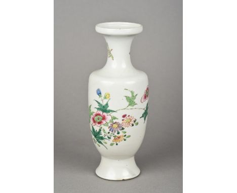 A Chinese porcelain vase Of baluster form, decorated with a bird amongst floral sprays.  21 cm high.    CONDITION REPORTS:  G