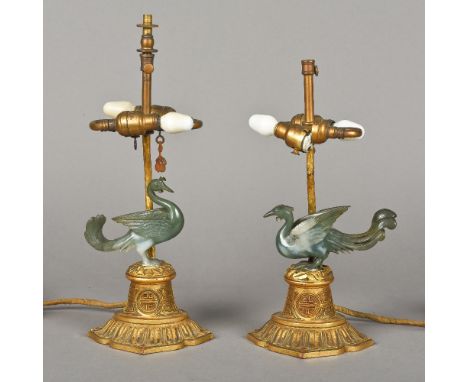 A pair of Chinese table lampsEach carved giltwood base surmounted with a jade bird.  The largest 35 cm high overall.  (2)   C