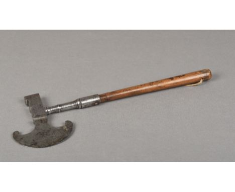 An 18th/19th century sugar axeThe steel crescent blade opposing a hammer, the handle turned wood.  33.5 cm long.    CONDITION
