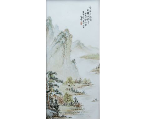 A Chinese porcelain plaqueDecorated with an extensive mountainous river landscape, signed with calligraphic text and red seal